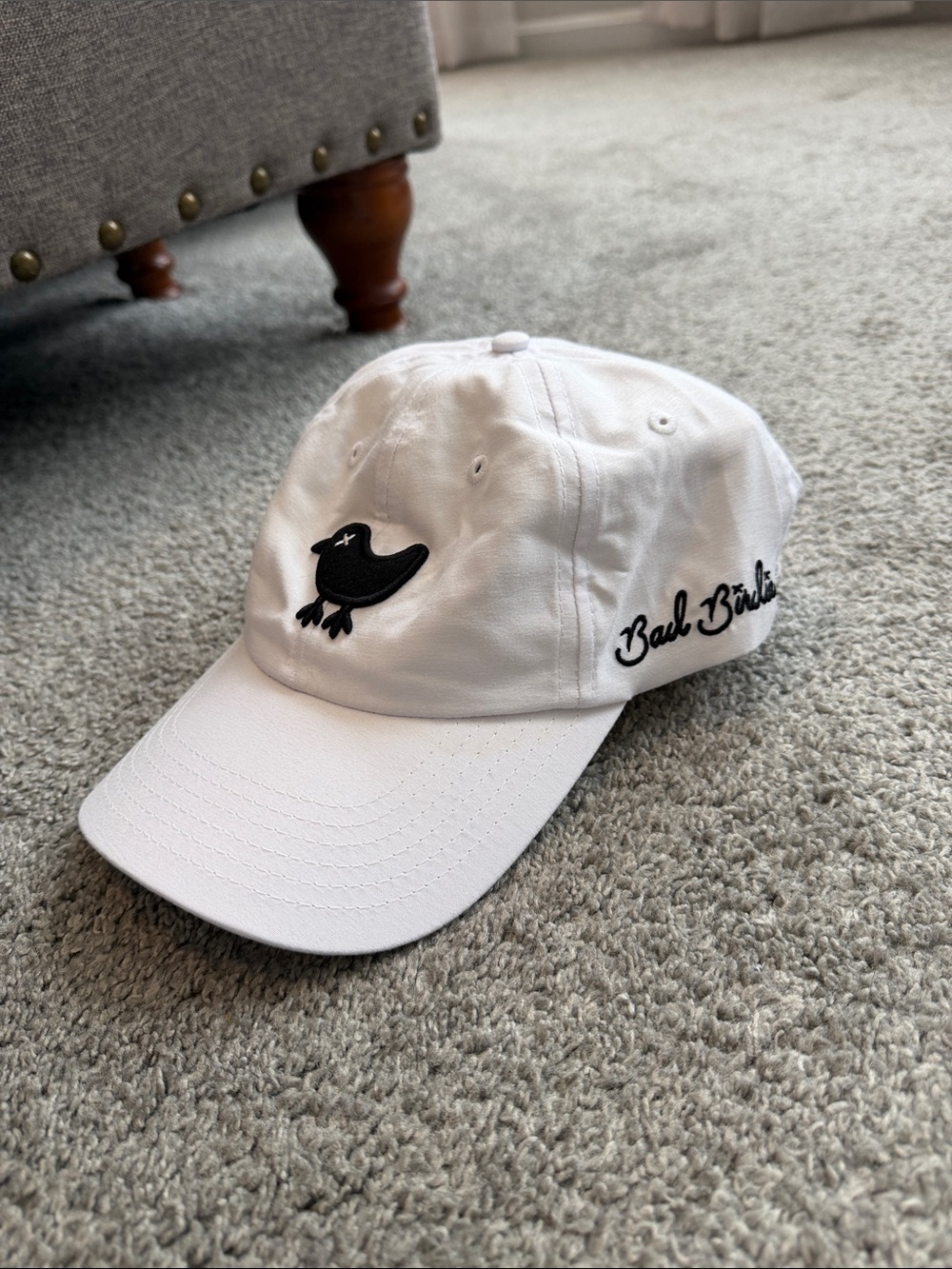Bad Birdie White Baseball Cap with Black Bird Patch